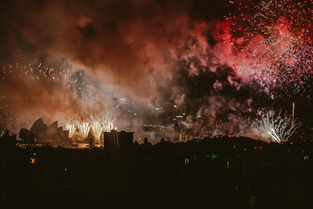 Spectacular New Year’s Eve fireworks over Sydney Harbour with Opera House and Harbour Bridge lit up