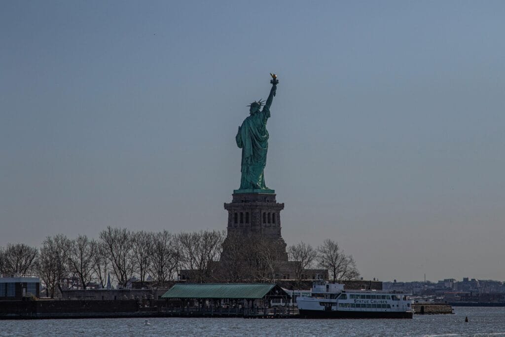 Ferry ride to the Statue of Liberty and Ellis Island, a must-do activity for first-time visitors in New York City