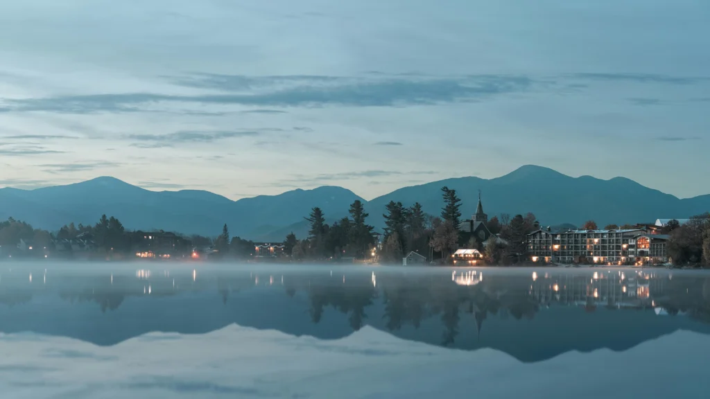 Snowy village of Lake Placid New York glowing with festive winter lights